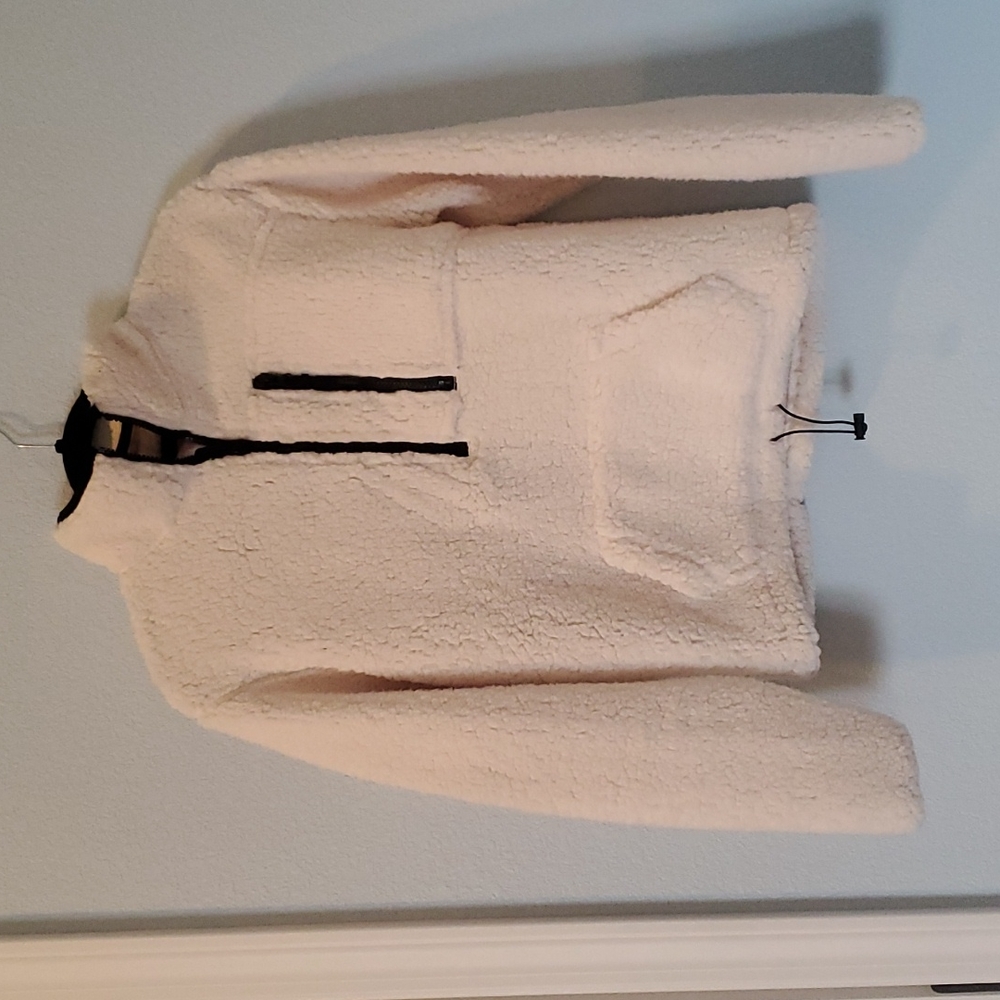 Junior's fleece sweatshirt.  Cream with black trim and zippers. Size 1.